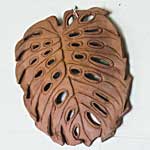 Monstera Leaf varandah or garden plaques, terracotta or glazed stoneware, hand carved